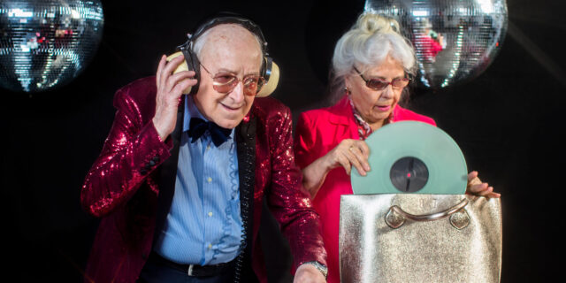 an amazing grandma and grandpa, older couple djing and partying in a disco setting